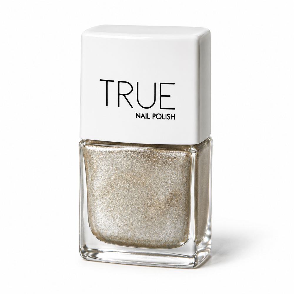 A bottle of TRUE Nail Polish in a shimmering champagne gold glitter shade, called 24 Carat. A vegan, plant based, breathable nail polish. featuring a white cap with black text, set against a plain white background.