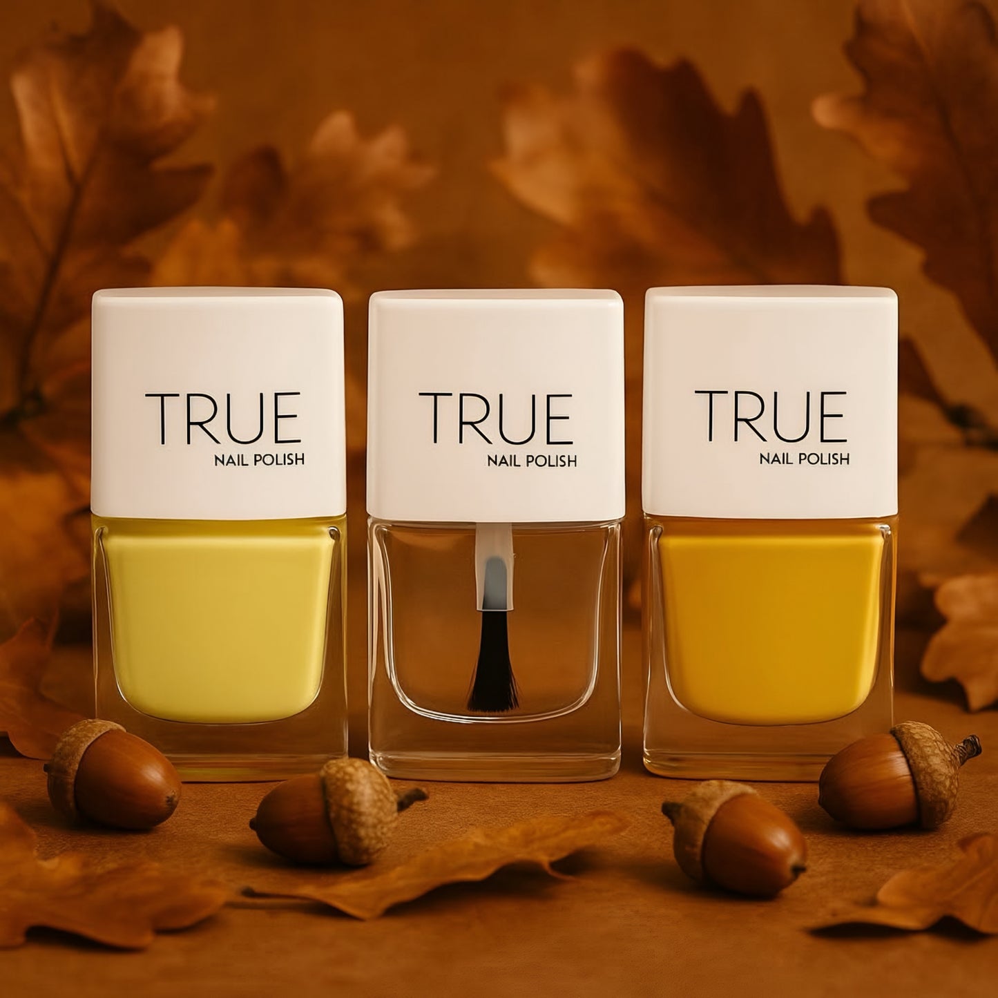 Three bottles of TRUE nail polish on a brown background with leaves and acorns.