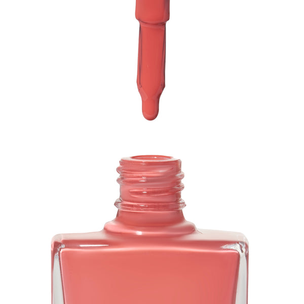A bottle of Devotion, a coral shade from True Nail Polish