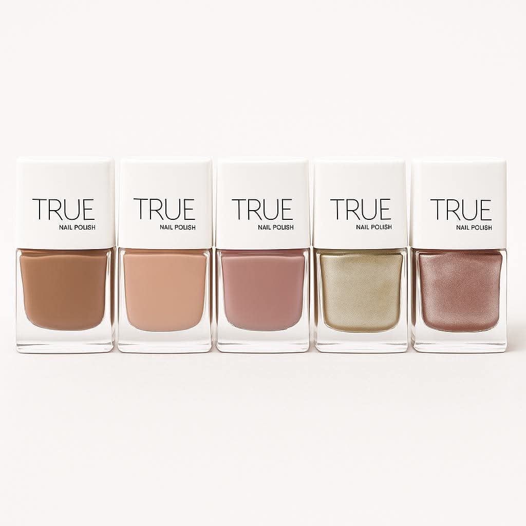 Five bottles of TRUE nail polish in a row on a white background