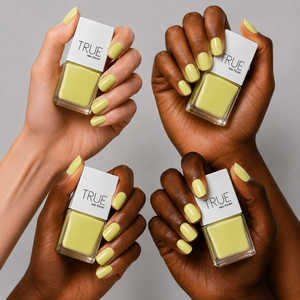 Manicure wearing Bikini bright yellow nail polish by TRUE Nail Polish with a glossy gel-effect finish, perfect for summer holidays, beach days and festival nails.