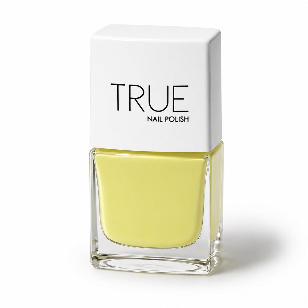 Bottle of Bikini bright yellow vegan nail polish by TRUE Nail Polish with a glossy gel-effect finish, vibrant colour and long-lasting chip-resistant formula.