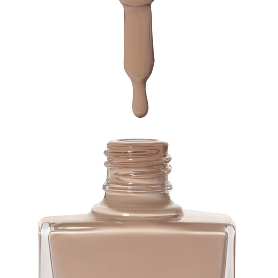 A bottle of Empathy a nude, pale brown shade shade from True Nail Polish