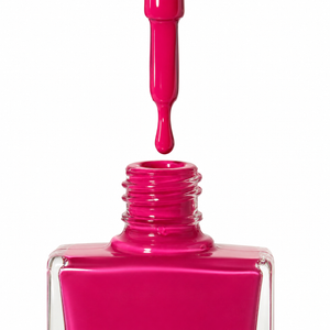 Bright fuchsia pink nail polish from true nail polish in a clear square bottle with the applicator brush dipped into the polish, shown against a white background. 