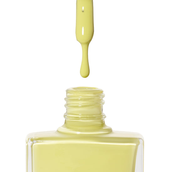 A bottle of Bikini, a bright yellow  from True Nail Polish