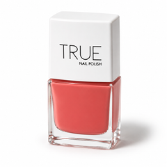 Bottle of Devotion coral vegan nail polish by TRUE Nail Polish with a glossy gel-effect finish and long-lasting chip-resistant formula.