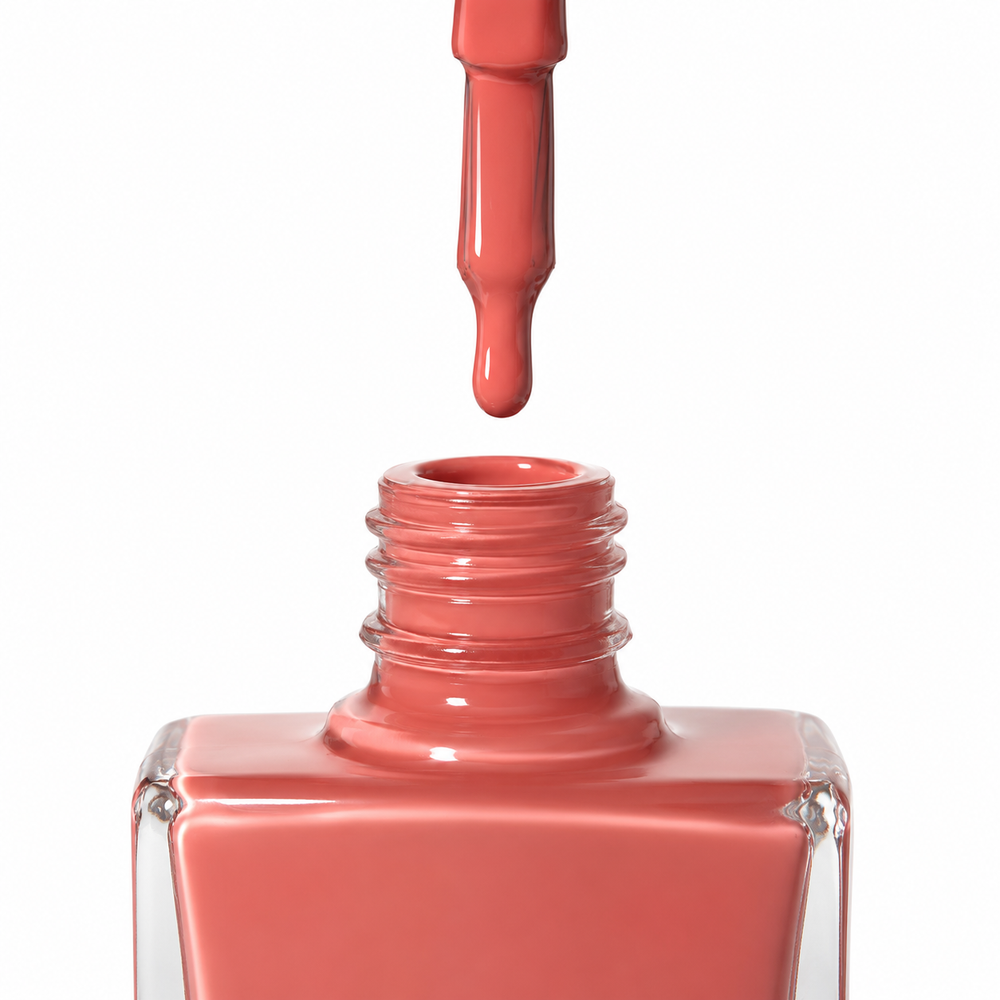Bottle of Devotion coral vegan nail polish by TRUE Nail Polish with a glossy gel-effect finish and long-lasting chip-resistant formula.