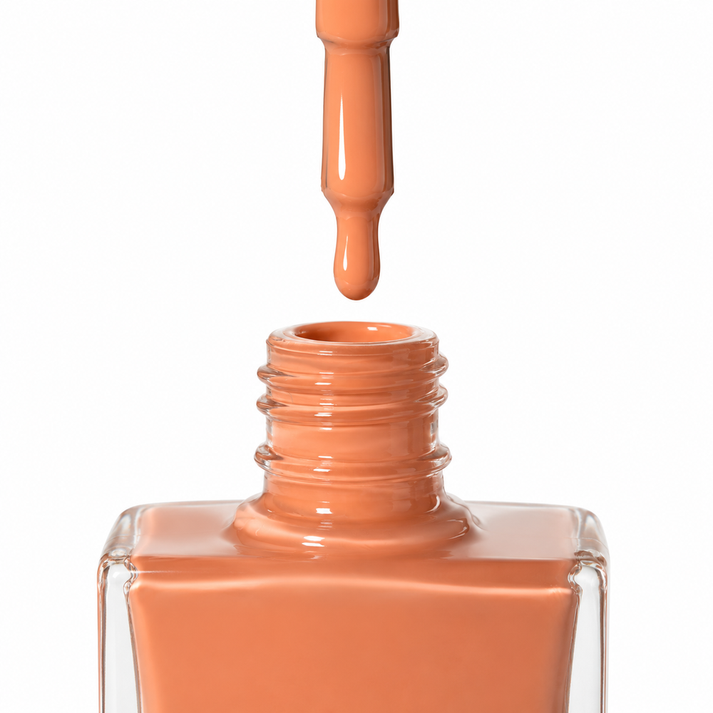 Bottle of Ibizan Sunset coral orange vegan nail polish by TRUE Nail Polish with a glossy gel-effect finish and long-lasting chip-resistant formula.