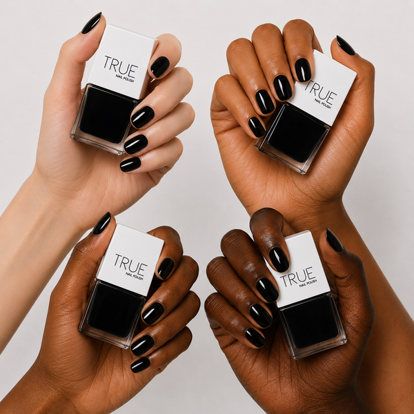 Manicure wearing L.B.D black nail polish by TRUE Nail Polish with a glossy gel-effect finish, perfect for evening wear, monochrome style and statement nails.