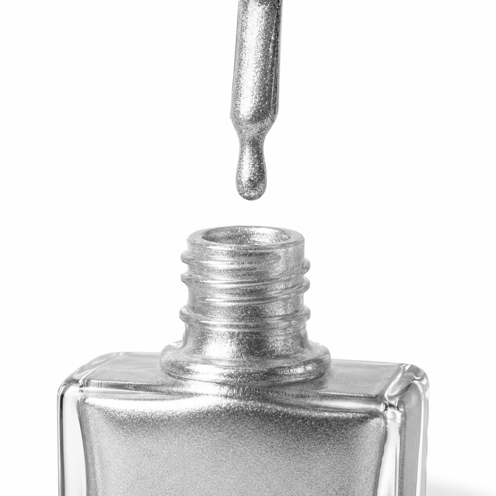 Bottle of Mirror Mirror reflective silver glitter vegan nail polish by TRUE Nail Polish with a glossy gel-effect finish and long-lasting chip-resistant formula.