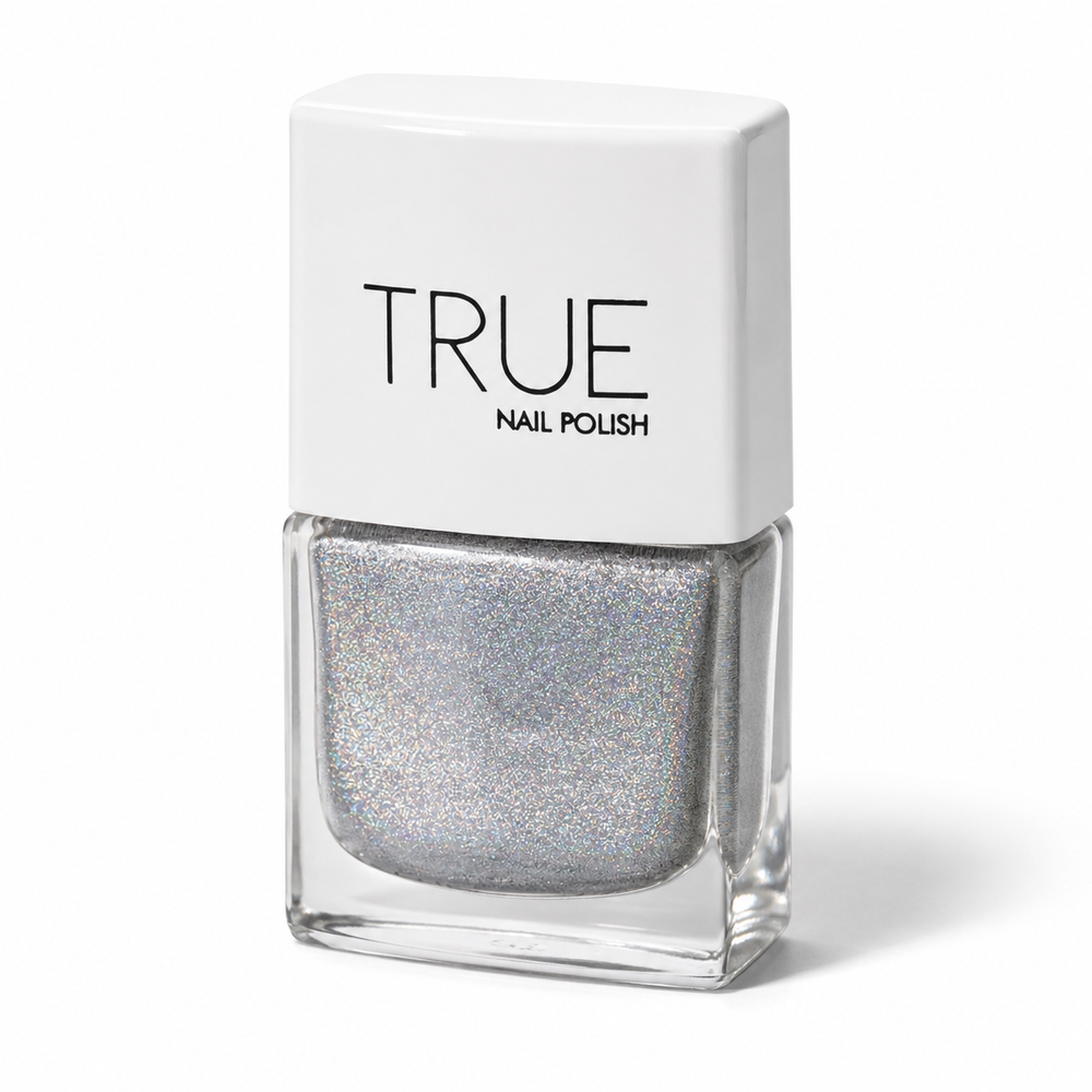 Bottle of Phenomenon silver holographic glitter vegan nail polish by TRUE Nail Polish with dazzling rainbow sparkle, glossy gel-effect finish and long-lasting chip-resistant formula.