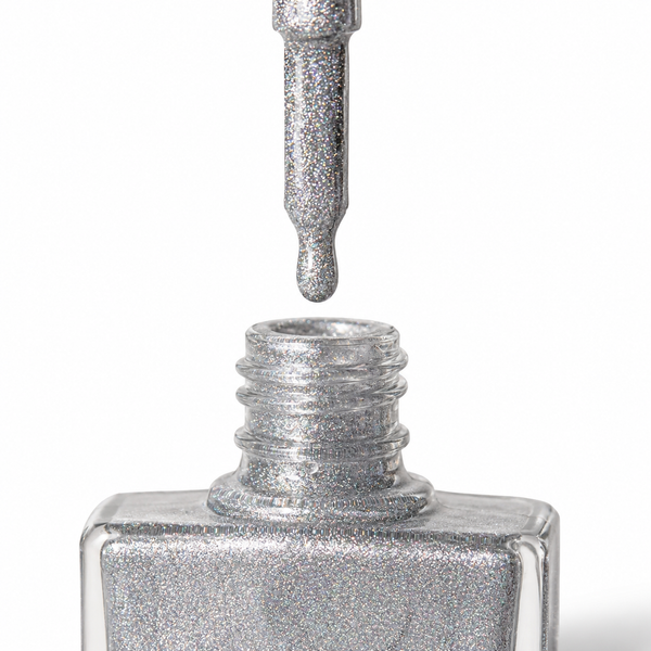 Silver holographic glitter nail polish by TRUE Nail Polish featuring a vegan, cruelty-free, quick-drying formula with brilliant rainbow shimmer and salon-quality shine.