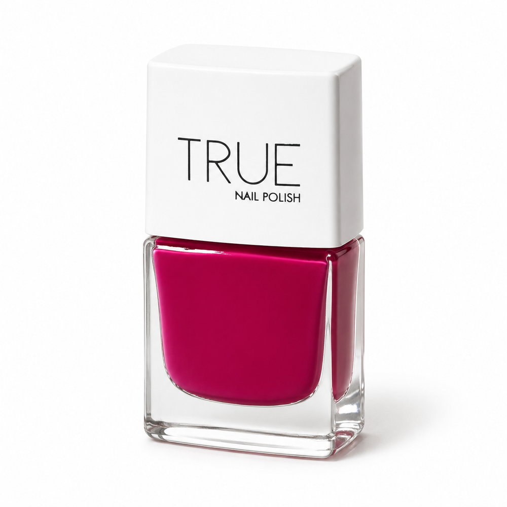 A bottle of TRUE Nail Polish in a vibrant magenta pink shade, called senorita featuring a white cap with the brand name 'TRUE' printed in black, set against a clean white background.