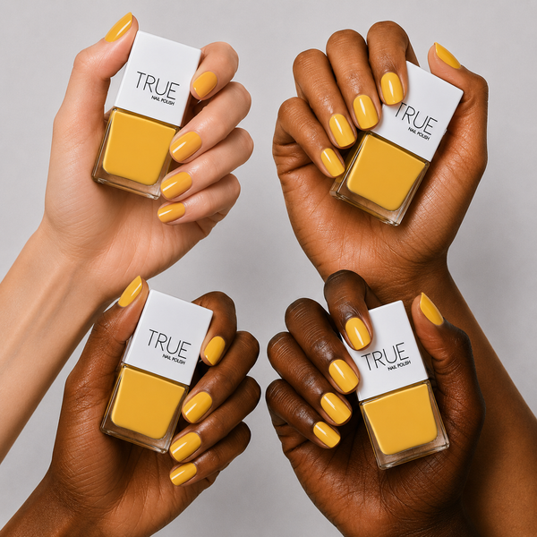 Manicure wearing Sunflower Fields bright yellow nail polish by TRUE Nail Polish with a glossy gel-effect finish, perfect for spring, summer and holiday nails.