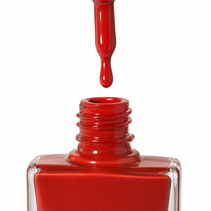A close-up of Spiced Rum a glossy red nail polish bottle with the applicator brush lifted above the open neck, showing a drop of the dark, burnt red polish about to fall out, on a white background.